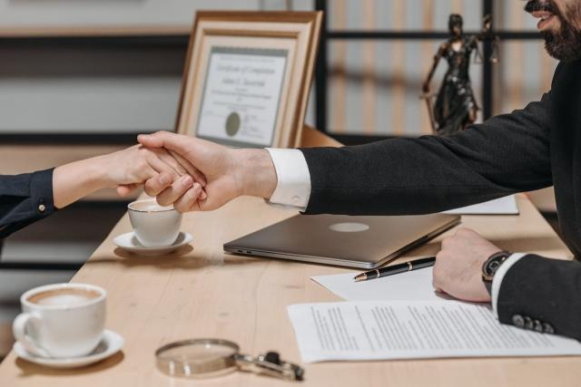 Photo by Pavel Danilyuk: https://www.pexels.com/photo/people-shaking-their-hands-in-close-deal-business-contract-8112180/