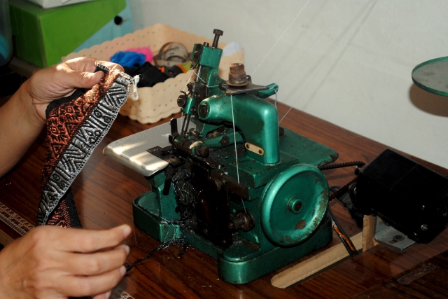 Embroidery specialists combine creativity and skill to craft fabric designs.